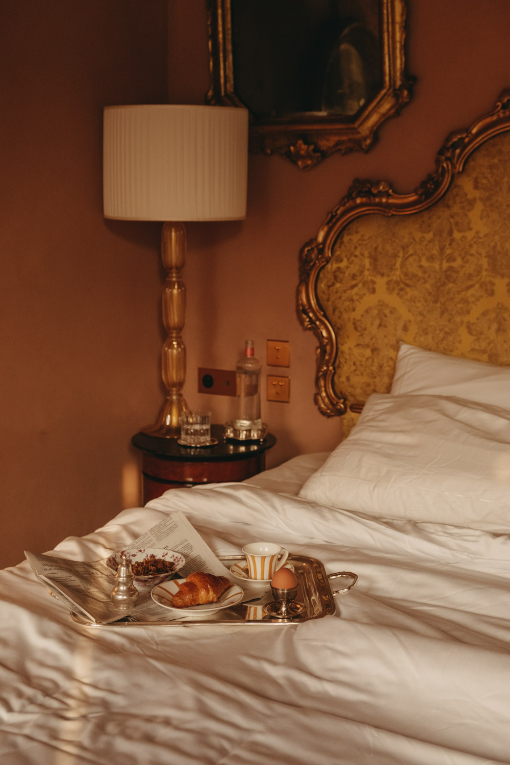 breakfast tray on a bed at passalacqua