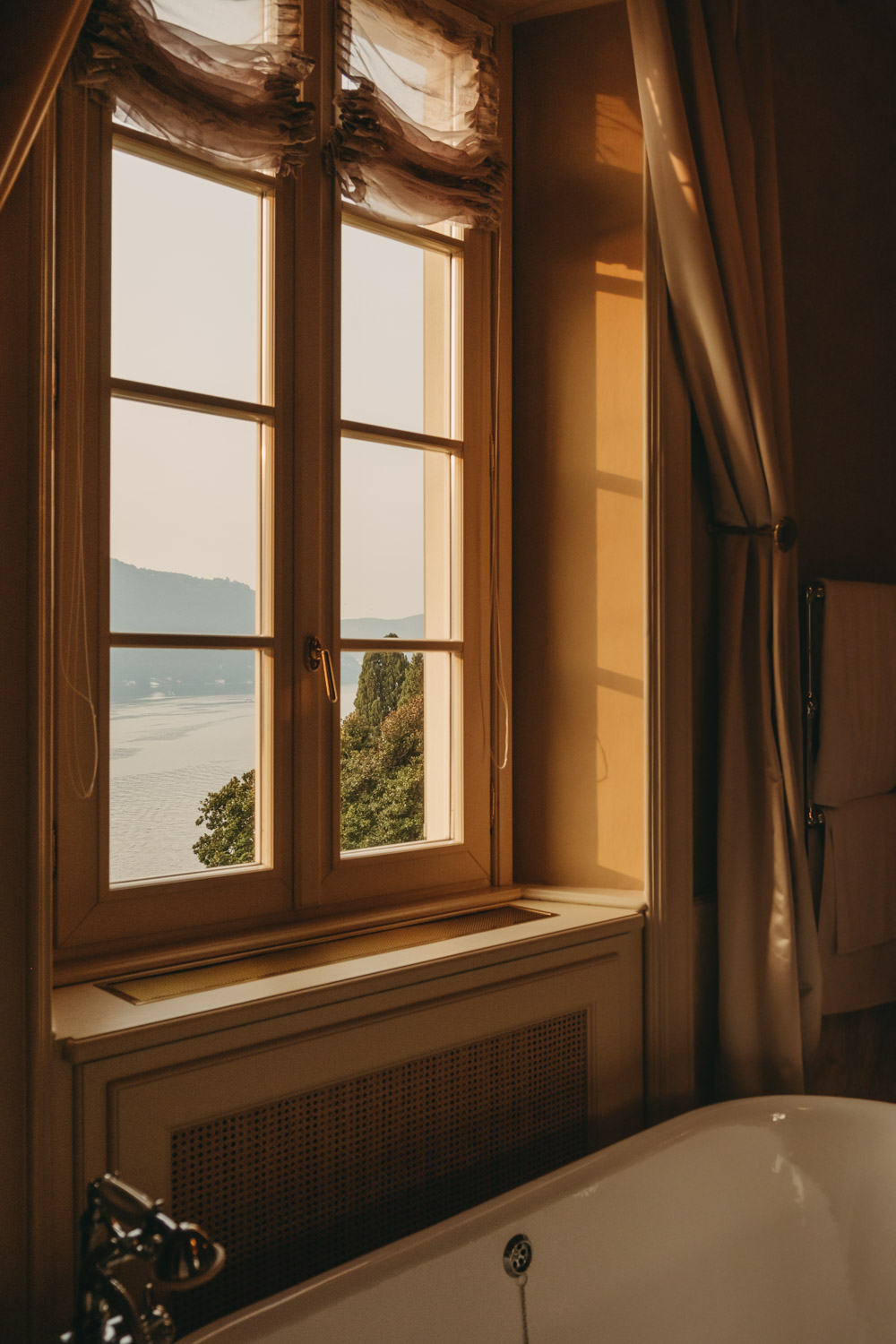 view of lake como from a bathroom at passalacqua